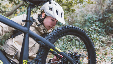 a person fixing a bicycle
