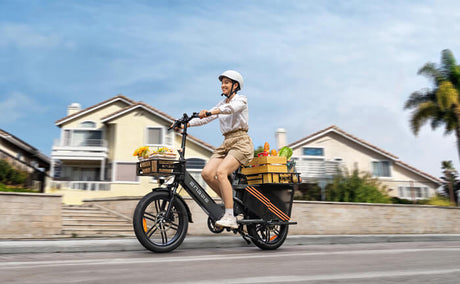 a person riding an engwe le20 electric cargo bike on the street