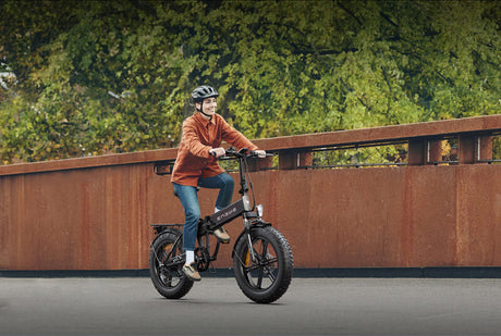 a woman rides an engwe ep-2 pro e-bike on the road